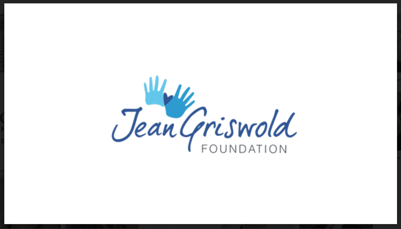 Logo of the Jean Griswold Foundation with blue text and two blue handprints, one larger and one smaller, overlapping above the text, symbolizing their commitment to elder home care services.