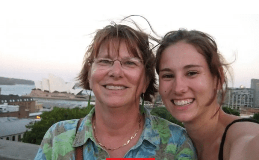 Two women smiling for a selfie with the Sydney Opera House in the background share a joyful moment made possible by reliable elder home care services.